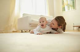 woman & baby planing on the floor together