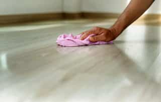 flooring maintenance, cleaning the floor with a rag